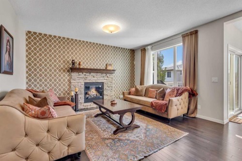 1544 Panatella Boulevard Nw, Calgary, AB - Indoor Photo Showing Living Room With Fireplace
