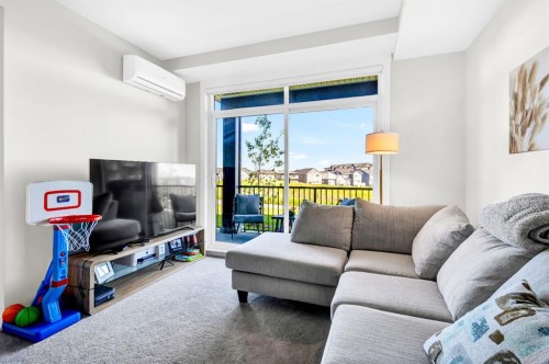 106-50 Sage Hill Nw, Calgary, AB - Indoor Photo Showing Living Room