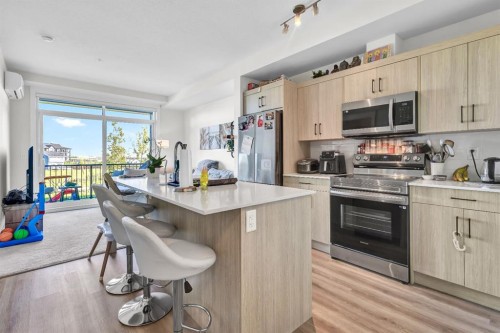 106-50 Sage Hill Walk Nw, Calgary, AB - Indoor Photo Showing Kitchen With Upgraded Kitchen