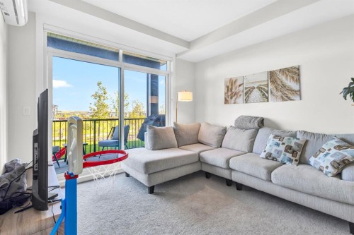 106-50 Sage Hill Walk Nw, Calgary, AB - Indoor Photo Showing Living Room