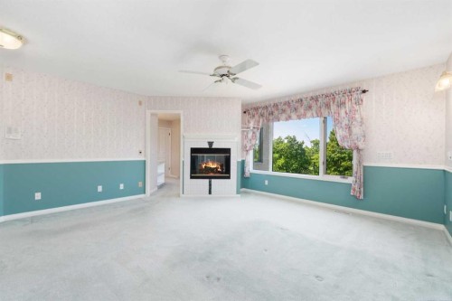 1600 Evergreen Hill Sw, Calgary, AB - Indoor Photo Showing Other Room With Fireplace