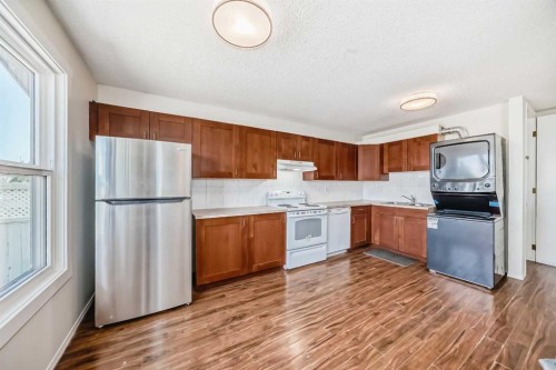 5307 Madigan Drive Ne, Calgary, AB - Indoor Photo Showing Kitchen With Double Sink