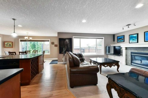 6 Royal Birkdale Court Nw, Calgary, AB - Indoor Photo Showing Living Room With Fireplace