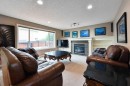 6 Royal Birkdale Court Nw, Calgary, AB  - Indoor Photo Showing Living Room With Fireplace 