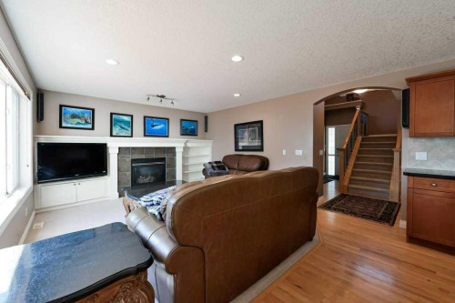 6 Royal Birkdale Court Nw, Calgary, AB - Indoor Photo Showing Living Room With Fireplace