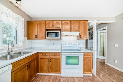 46 Coverdale Way Ne, Calgary, AB - Indoor Photo Showing Kitchen With Double Sink