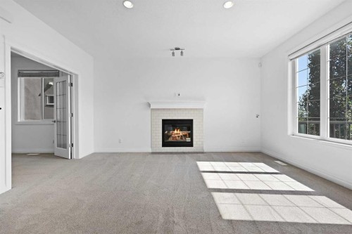 309 Sage Meadows Circle Nw, Calgary, AB - Indoor Photo Showing Living Room With Fireplace