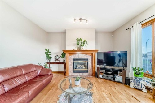 75 Hampstead Way Nw, Calgary, AB - Indoor Photo Showing Living Room With Fireplace