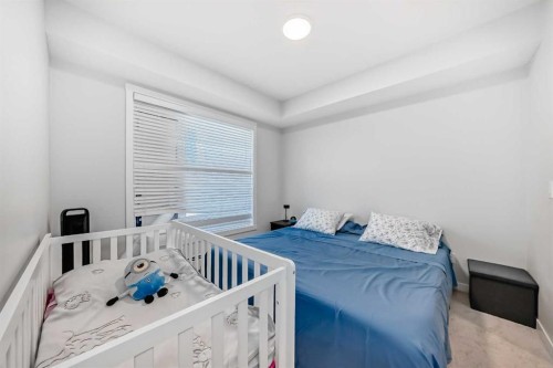 310-150 Shawnee Square, Calgary, AB - Indoor Photo Showing Bedroom