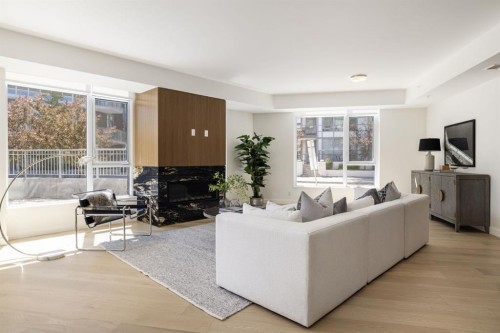 102-88 Waterfront Mews Sw, Calgary, AB - Indoor Photo Showing Living Room