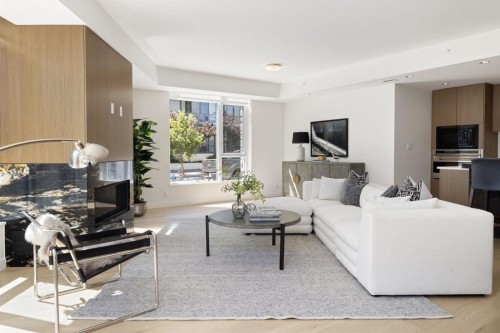 102-88 Waterfront Mews Sw, Calgary, AB - Indoor Photo Showing Living Room