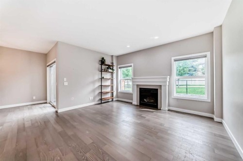 41 Shawnee Green Sw, Calgary, AB - Indoor Photo Showing Living Room With Fireplace
