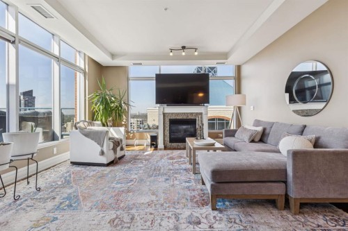 2802-910 5 Avenue Sw, Calgary, AB - Indoor Photo Showing Living Room With Fireplace