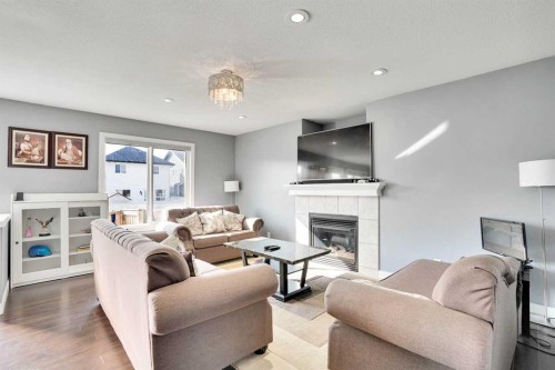151 Saddlehorn Close Ne, Calgary, AB - Indoor Photo Showing Living Room With Fireplace