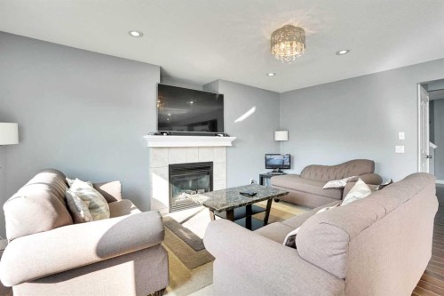 151 Saddlehorn Close Ne, Calgary, AB - Indoor Photo Showing Living Room With Fireplace
