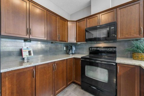 129-1 Crystal Green Lane, Okotoks, AB - Indoor Photo Showing Kitchen