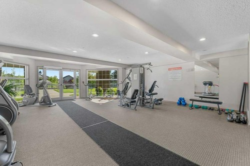 129-1 Crystal Green Lane, Okotoks, AB - Indoor Photo Showing Gym Room