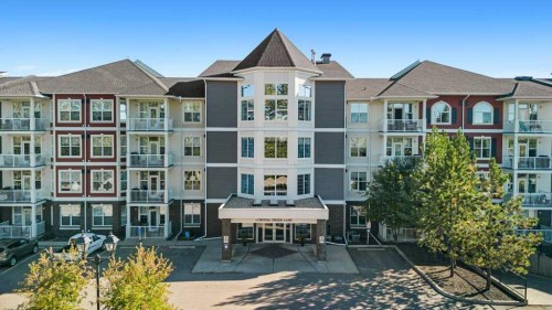 129-1 Crystal Green Lane, Okotoks, AB - Outdoor With Facade