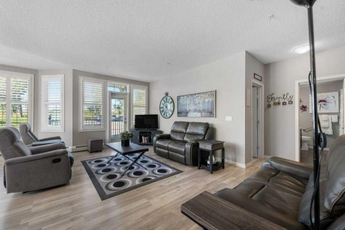 129-1 Crystal Green Lane, Okotoks, AB - Indoor Photo Showing Living Room