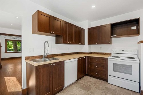 1640 15 Street Se, Calgary, AB - Indoor Photo Showing Kitchen With Double Sink