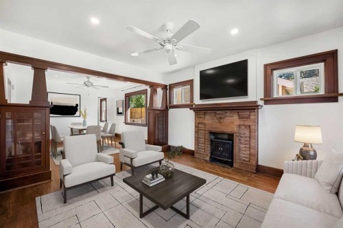 1640 15 Street Se, Calgary, AB - Indoor Photo Showing Living Room With Fireplace