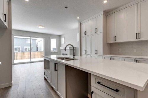435 Rivercrest Road, Cochrane, AB - Indoor Photo Showing Kitchen With Double Sink