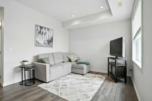 123-115 Sagewood Drive Sw, Airdrie, AB - Indoor Photo Showing Living Room
