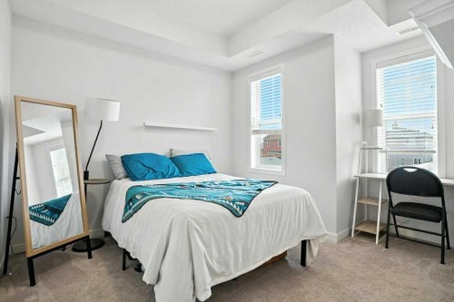 123-115 Sagewood Drive Sw, Airdrie, AB - Indoor Photo Showing Bedroom