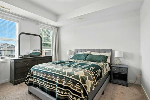 123-115 Sagewood Drive Sw, Airdrie, AB - Indoor Photo Showing Bedroom