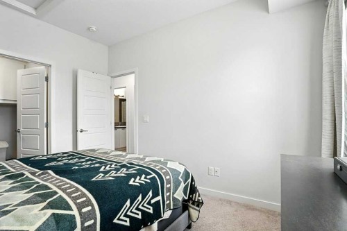 123-115 Sagewood Drive Sw, Airdrie, AB - Indoor Photo Showing Bedroom