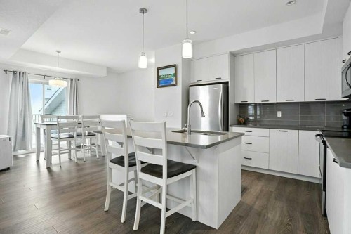 123-115 Sagewood Drive Sw, Airdrie, AB - Indoor Photo Showing Kitchen With Stainless Steel Kitchen With Upgraded Kitchen