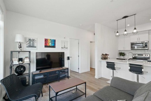 217-205 Spring Creek Common Sw, Calgary, AB - Indoor Photo Showing Living Room