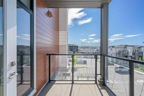 217-205 Spring Creek Common Sw, Calgary, AB - Outdoor With Balcony With Exterior