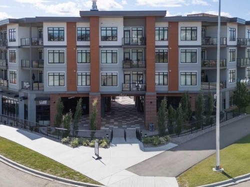 217-205 Spring Creek Common Sw, Calgary, AB - Outdoor With Balcony With Facade