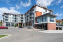 217-205 Spring Creek Common Sw, Calgary, AB  - Outdoor With Balcony With Facade 