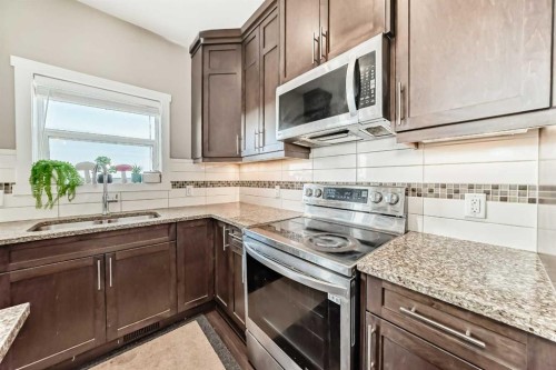 520 Redstone View Ne, Calgary, AB - Indoor Photo Showing Kitchen With Double Sink