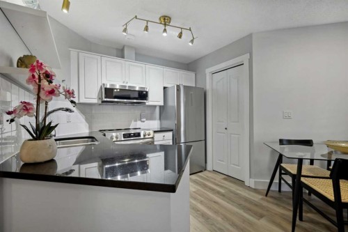 210-10 Sierra Morena Mews Sw, Calgary, AB - Indoor Photo Showing Kitchen With Stainless Steel Kitchen