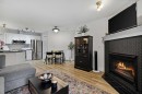 210-10 Sierra Morena Mews Sw, Calgary, AB  - Indoor Photo Showing Living Room With Fireplace 