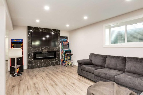 392 Cantrell Drive Sw, Calgary, AB - Indoor With Fireplace