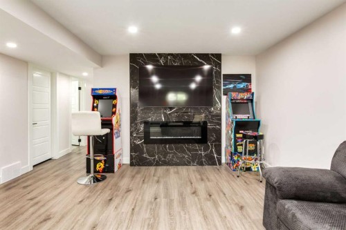 392 Cantrell Drive Sw, Calgary, AB - Indoor Photo Showing Other Room With Fireplace