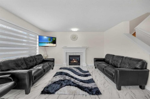 143 Taralake Way Ne, Calgary, AB - Indoor Photo Showing Living Room With Fireplace