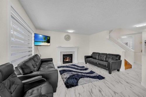 143 Taralake Way Ne, Calgary, AB - Indoor Photo Showing Living Room With Fireplace
