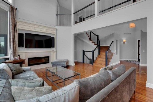 58 Scimitar View Nw, Calgary, AB - Indoor Photo Showing Living Room With Fireplace