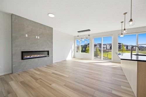 232 Belmont Park Sw, Calgary, AB - Indoor Photo Showing Living Room With Fireplace