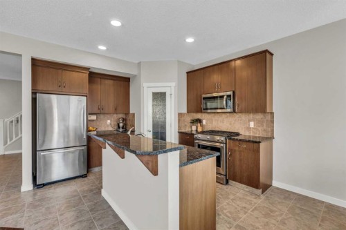 57 Silverado Skies Drive Sw, Calgary, AB - Indoor Photo Showing Kitchen With Double Sink