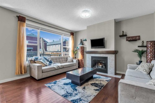 57 Silverado Skies Drive Sw, Calgary, AB - Indoor Photo Showing Living Room With Fireplace