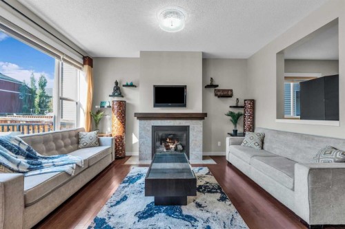 57 Silverado Skies Drive Sw, Calgary, AB - Indoor Photo Showing Living Room With Fireplace