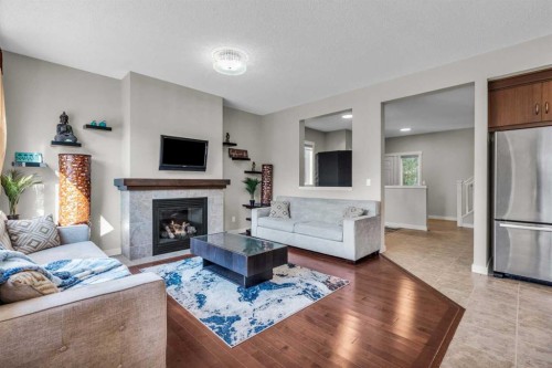 57 Silverado Skies Drive Sw, Calgary, AB - Indoor Photo Showing Living Room With Fireplace