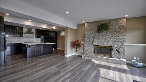 57 Edelweiss Point Nw, Calgary, AB - Indoor With Fireplace