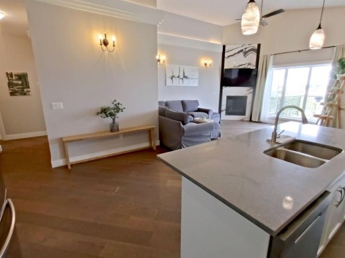 702 Fairways Drive, Vulcan, AB - Indoor Photo Showing Kitchen With Double Sink